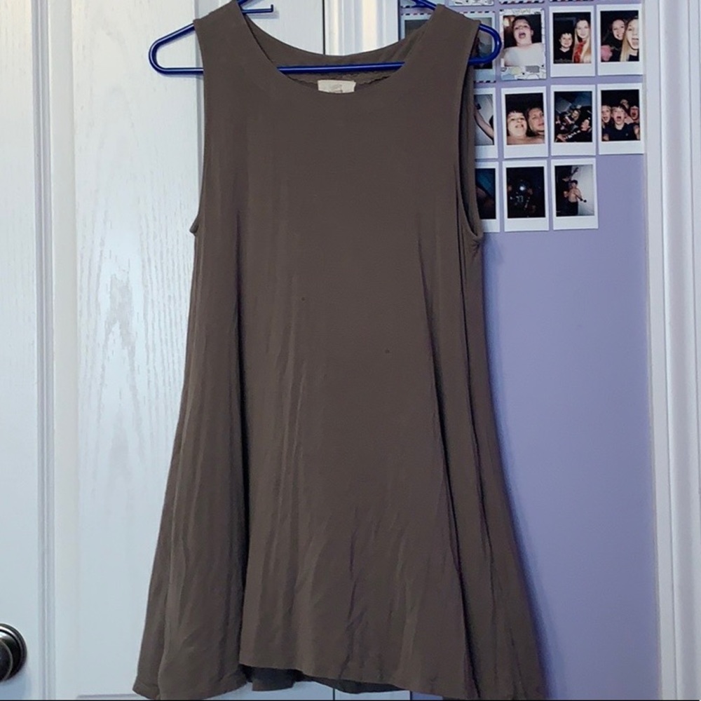 green sleeveless shirt